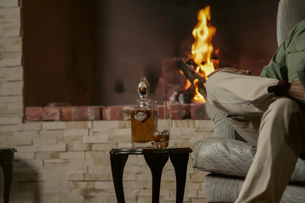 A whisky by the fire in a South African hunting lodge