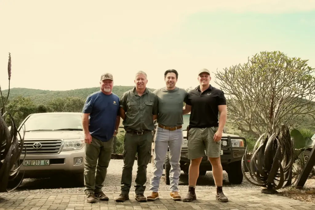The Safari Specialists team with their trucks at a South African lodge